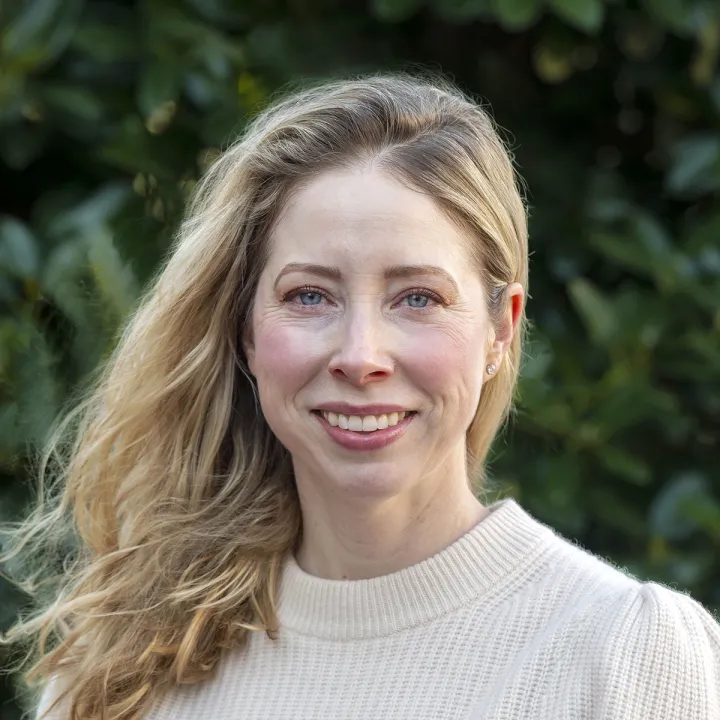 A professional headshot ofJennifer Houston. She has blonde shoulder-length hair and wears an ivory sweater.
