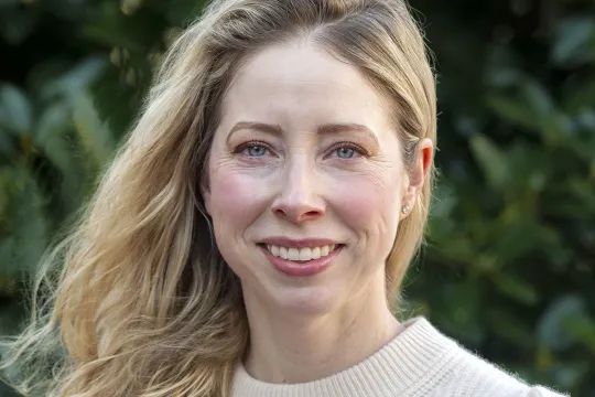 A professional headshot ofJennifer Houston. She has blonde shoulder-length hair and wears an ivory sweater.
