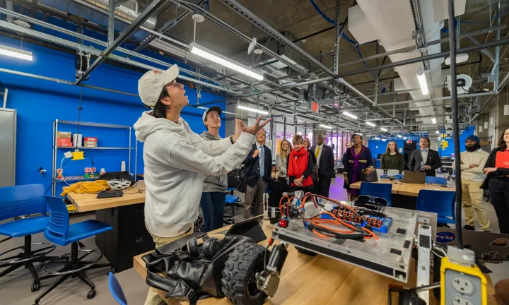University of Maryland students give a tour of the E.A. Fernandez IDEA lab while Clark Foundation team looks on.
