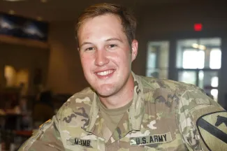 Army officer Addison McLamb smiles while wearing his uniform