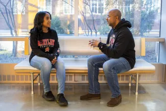 A student chats with Michael Robinson, recruitment coordinator for UMD’s Clark Foundation scholarship programs