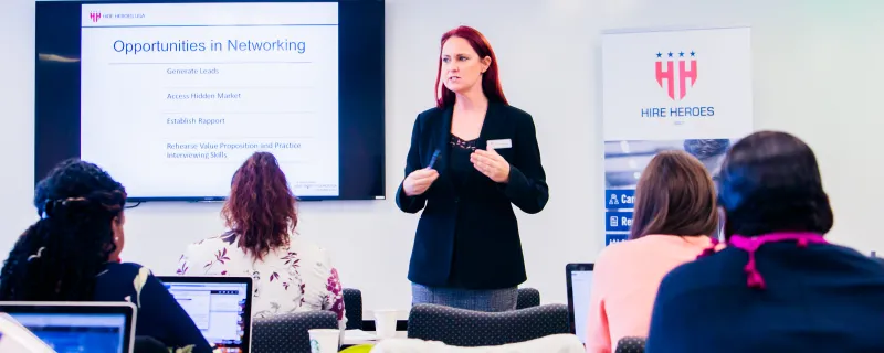 A speaker gives a networking presentation to participants in a Hire Heroes training.
